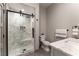 Contemporary bathroom with a glass-enclosed shower, marble tiling, and modern fixtures at 7880 Dana Point Ct, Las Vegas, NV 89117