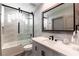 Beautiful bathroom features a shower-over-tub, decorative tile, and modern vanity at 7880 Dana Point Ct, Las Vegas, NV 89117
