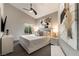 Bright bedroom with modern decor, a ceiling fan, neutral walls and plush bedding, offering a serene retreat at 7880 Dana Point Ct, Las Vegas, NV 89117