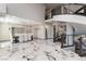 Elegant dining room with a spiral staircase and seating for eight guests at 7880 Dana Point Ct, Las Vegas, NV 89117