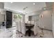 Formal dining area with modern chandelier and marble floors at 7880 Dana Point Ct, Las Vegas, NV 89117