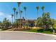 Two-story luxury home with a circular driveway and palm trees at 7880 Dana Point Ct, Las Vegas, NV 89117