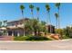 Home exterior featuring a three car garage and desert landscaping at 7880 Dana Point Ct, Las Vegas, NV 89117