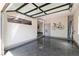 Modern garage featuring a sleek epoxy floor, a transparent ceiling, and wall-mounted bicycle racks at 7880 Dana Point Ct, Las Vegas, NV 89117