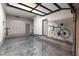 Well-organized garage with epoxy flooring, transparent ceiling, and custom storage solutions at 7880 Dana Point Ct, Las Vegas, NV 89117