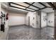 Spacious garage featuring epoxy flooring, glass doors, and a bicycle rack at 7880 Dana Point Ct, Las Vegas, NV 89117