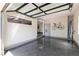 Bright garage featuring an epoxy floor, ample lighting, and a side window, offering a versatile space at 7880 Dana Point Ct, Las Vegas, NV 89117