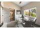 Stylish home office with large window, modern desk, and a view of the outdoor landscape at 7880 Dana Point Ct, Las Vegas, NV 89117