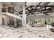 Open-concept living room showcasing marble floors, exposed beams, and a curved staircase at 7880 Dana Point Ct, Las Vegas, NV 89117