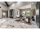 Inviting living room featuring large windows, marble floors, and modern decor at 7880 Dana Point Ct, Las Vegas, NV 89117