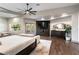 Main bedroom with fireplace, large windows, and walk-in closet at 7880 Dana Point Ct, Las Vegas, NV 89117