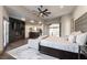 A luxurious main bedroom boasts a fireplace, a sitting area, and doors to the outside at 7880 Dana Point Ct, Las Vegas, NV 89117