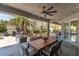 Inviting outdoor patio with a dining area, ceiling fan, and view of the landscaped backyard at 7880 Dana Point Ct, Las Vegas, NV 89117