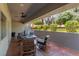 Comfortable outdoor seating area with a fire pit, offering a cozy space to relax and enjoy the landscaped backyard at 7880 Dana Point Ct, Las Vegas, NV 89117