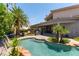 Relaxing pool and spa with a large patio and lush landscaping at 7880 Dana Point Ct, Las Vegas, NV 89117