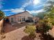 Spacious backyard with patio cover, grill, and mature landscaping at 8116 Sedona Sunset Dr, Las Vegas, NV 89128