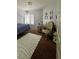 Bright bedroom with a comfortable bed, chair, and decorative rug at 8116 Sedona Sunset Dr, Las Vegas, NV 89128