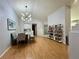 Dining area with hardwood floors, a modern light fixture, and seating for four at 8116 Sedona Sunset Dr, Las Vegas, NV 89128