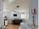 Bright dining room features a table with chairs, hardwood floors, and a ceiling fan at 8116 Sedona Sunset Dr, Las Vegas, NV 89128