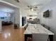 Spacious dining area with marble table and kitchen access at 8116 Sedona Sunset Dr, Las Vegas, NV 89128