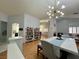 Dining room with hardwood floors, marble table, and a modern light fixture at 8116 Sedona Sunset Dr, Las Vegas, NV 89128