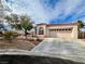 Single-story house with a two-car garage and nicely landscaped front yard at 8116 Sedona Sunset Dr, Las Vegas, NV 89128