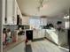 Well-equipped kitchen with white cabinets and tile flooring at 8116 Sedona Sunset Dr, Las Vegas, NV 89128