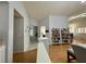 Living room with hardwood floors, built-in shelving, and views to the dining area at 8116 Sedona Sunset Dr, Las Vegas, NV 89128