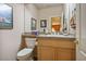 Simple and clean bathroom with light wood vanity and toilet at 816 Sandsprings St, Henderson, NV 89011