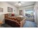 Bright bedroom with wood bed frame and window views at 816 Sandsprings St, Henderson, NV 89011