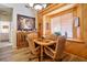 Dining area with wood table and chairs, built-in window seat, and wood accents at 816 Sandsprings St, Henderson, NV 89011