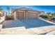 Three-car garage with a tan stucco exterior and tile roof at 816 Sandsprings St, Henderson, NV 89011