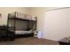 Bedroom with a bunk bed, desk, and sliding glass door at 833 Aspen Peak Loop # 2225, Henderson, NV 89011