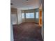 Dining area with carpeted floor and large windows at 833 Aspen Peak Loop # 2225, Henderson, NV 89011