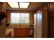 Cozy kitchen with wood cabinets, stainless steel appliances, and a window at 833 Aspen Peak Loop # 2225, Henderson, NV 89011