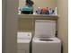 Laundry area with washer, dryer, and overhead shelving at 833 Aspen Peak Loop # 2225, Henderson, NV 89011