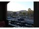 View of the parking lot and other buildings from a balcony at 833 Aspen Peak Loop # 2225, Henderson, NV 89011