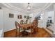 Elegant dining room with hardwood floors and a chandelier at 8529 Copper Knoll Ave, Las Vegas, NV 89129