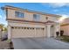 Two-story house with three-car garage and landscaping at 8529 Copper Knoll Ave, Las Vegas, NV 89129