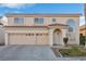 Two-story house with three-car garage and landscaping at 8529 Copper Knoll Ave, Las Vegas, NV 89129