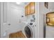 Convenient laundry room with washer, dryer, and cabinets at 8529 Copper Knoll Ave, Las Vegas, NV 89129