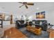 Relaxing living room with hardwood floors and comfortable seating at 8529 Copper Knoll Ave, Las Vegas, NV 89129