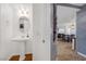 Stylish powder room with pedestal sink and mirror at 8529 Copper Knoll Ave, Las Vegas, NV 89129