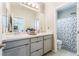 Modern bathroom with double sinks and a shower/tub combo at 8595 Old Daylily Ln, Las Vegas, NV 89113