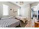 Guest bedroom with two twin beds, and a view into the living room at 8595 Old Daylily Ln, Las Vegas, NV 89113