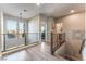 Upstairs hallway with wood-look floors and modern light fixture at 8595 Old Daylily Ln, Las Vegas, NV 89113