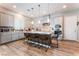 Modern kitchen with island, stainless steel appliances, and light gray cabinets at 8595 Old Daylily Ln, Las Vegas, NV 89113