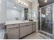 Main bathroom with walk-in shower and single vanity at 8595 Old Daylily Ln, Las Vegas, NV 89113