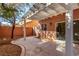 Covered patio with pergola, concrete flooring, and a landscaped area at 8809 Early Horizon Dr, Las Vegas, NV 89178