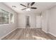 Spacious bedroom with ceiling fan and large window at 8809 Early Horizon Dr, Las Vegas, NV 89178